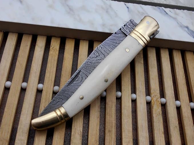 Laguiole Folding Damascus Steel Knife, 8.6" Long with 4.1" Hand Forged Custom Twist patren Blade. Wine 2 Tone Dollar Wood & Brass Bolster Scale. Cow Hide Leather Sheath Included (White)