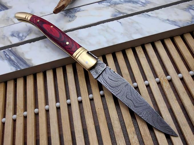 Damascus Depot Laguiole style Folding knife with real Damascus steel blade, 8.5" Long with 4" hand forged twist patren Blade. wood, Camel Bone and Bull horn scale with brass bolster. Cow hide leather sheath included