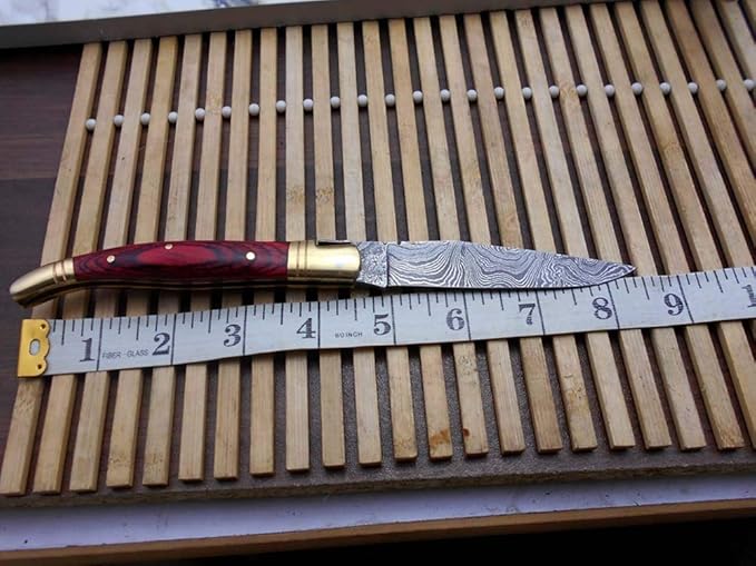 Damascus Depot Laguiole style Folding knife with real Damascus steel blade, 8.5" Long with 4" hand forged twist patren Blade. wood, Camel Bone and Bull horn scale with brass bolster. Cow hide leather sheath included