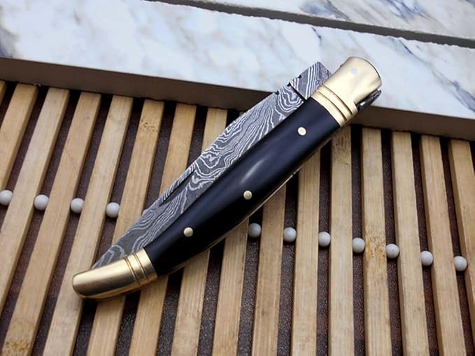 Laguiole Folding Damascus steel knife, 8.6" Long with 4.1" hand forged custom twist patren Blade. Wine 2 Tone Dollar wood & brass bolster scale. Cow hide leather sheath included (Bull Horn)