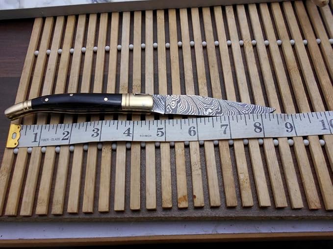 Laguiole Folding Damascus steel knife, 8.6" Long with 4.1" hand forged custom twist patren Blade. Wine 2 Tone Dollar wood & brass bolster scale. Cow hide leather sheath included (Bull Horn)